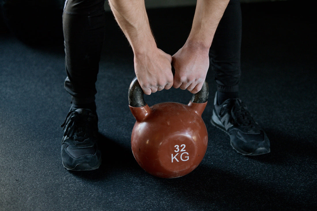 man holding kettlebell